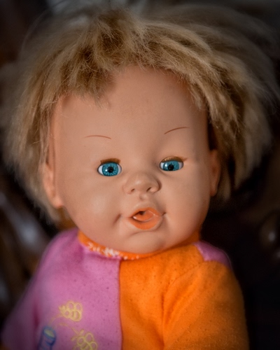 Immagine con occhi, bambola, bocca, arancione, capelli, giocattolo, bambolotto, rosa, azzurri