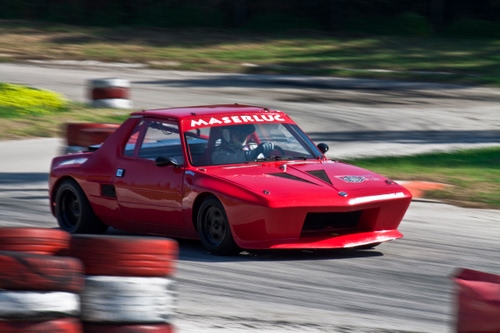 Immagine con rosso, auto, rossa, corsa, automobile, pilota, gara, gomme, strada, movimento, ruote, pista